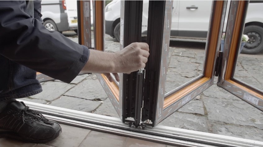 Man Installing Bifolding Doors