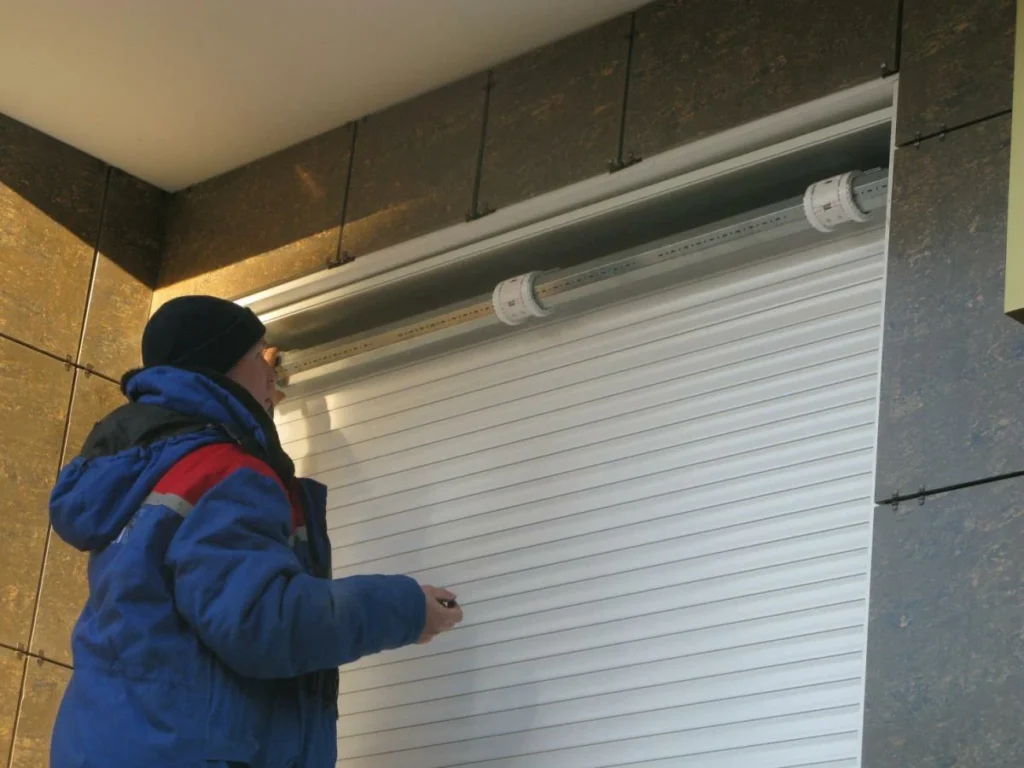 man installing shutter