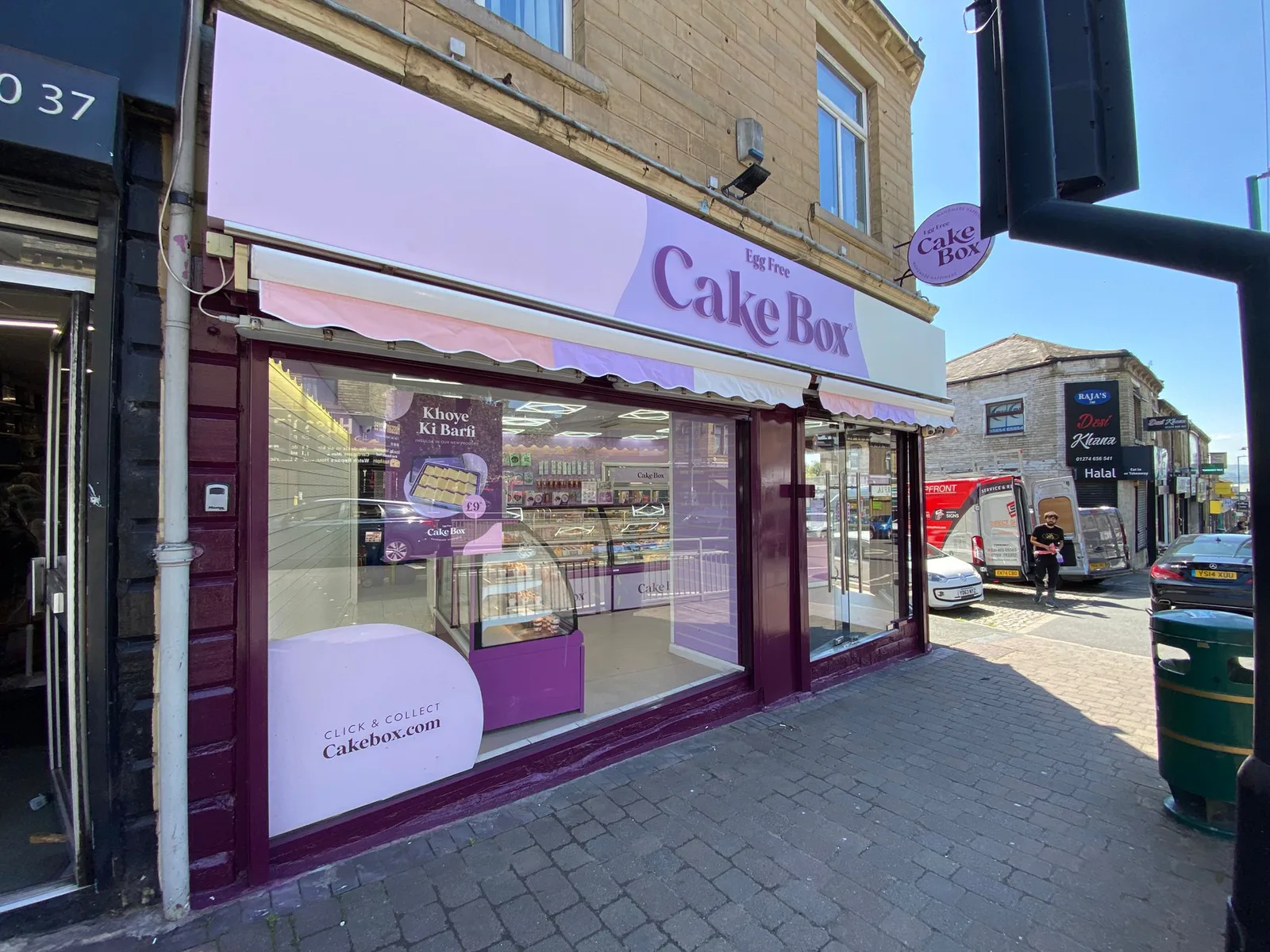 Cake Box shopfront by Direct Shopfront – lilac fascia on a stone building