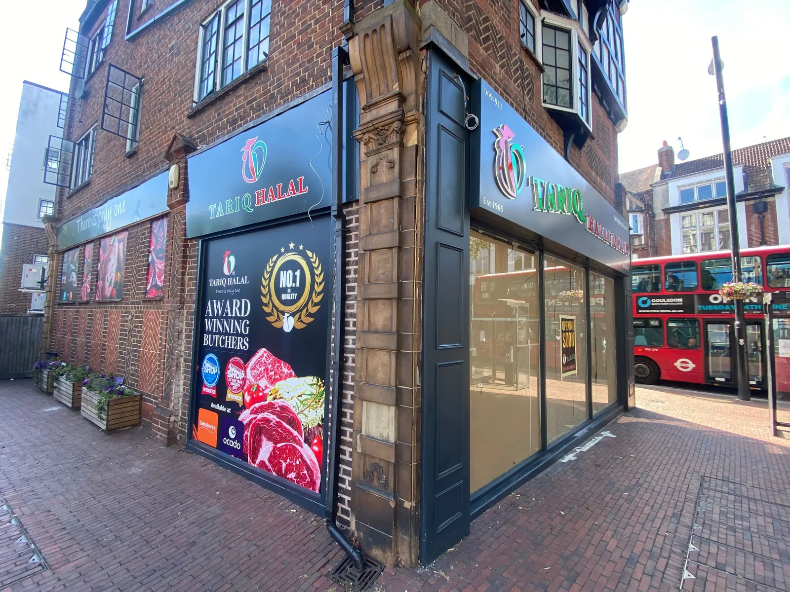 Tariq Halal Meats shopfront by Direct Shopfront – black-framed corner unit with window graphics
